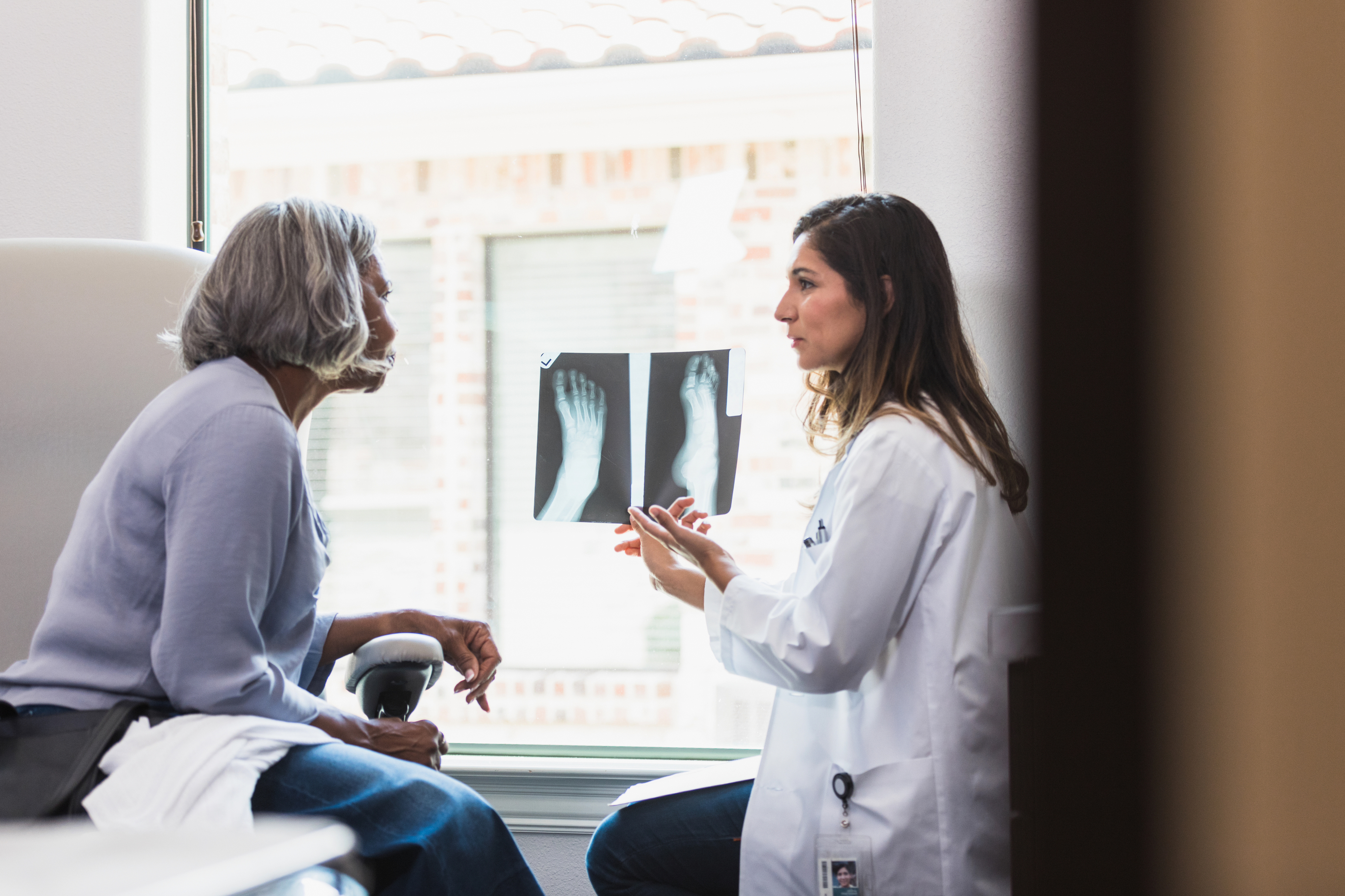 iStock-1271562602_provider_patient_female_diverse_senior_podiatry